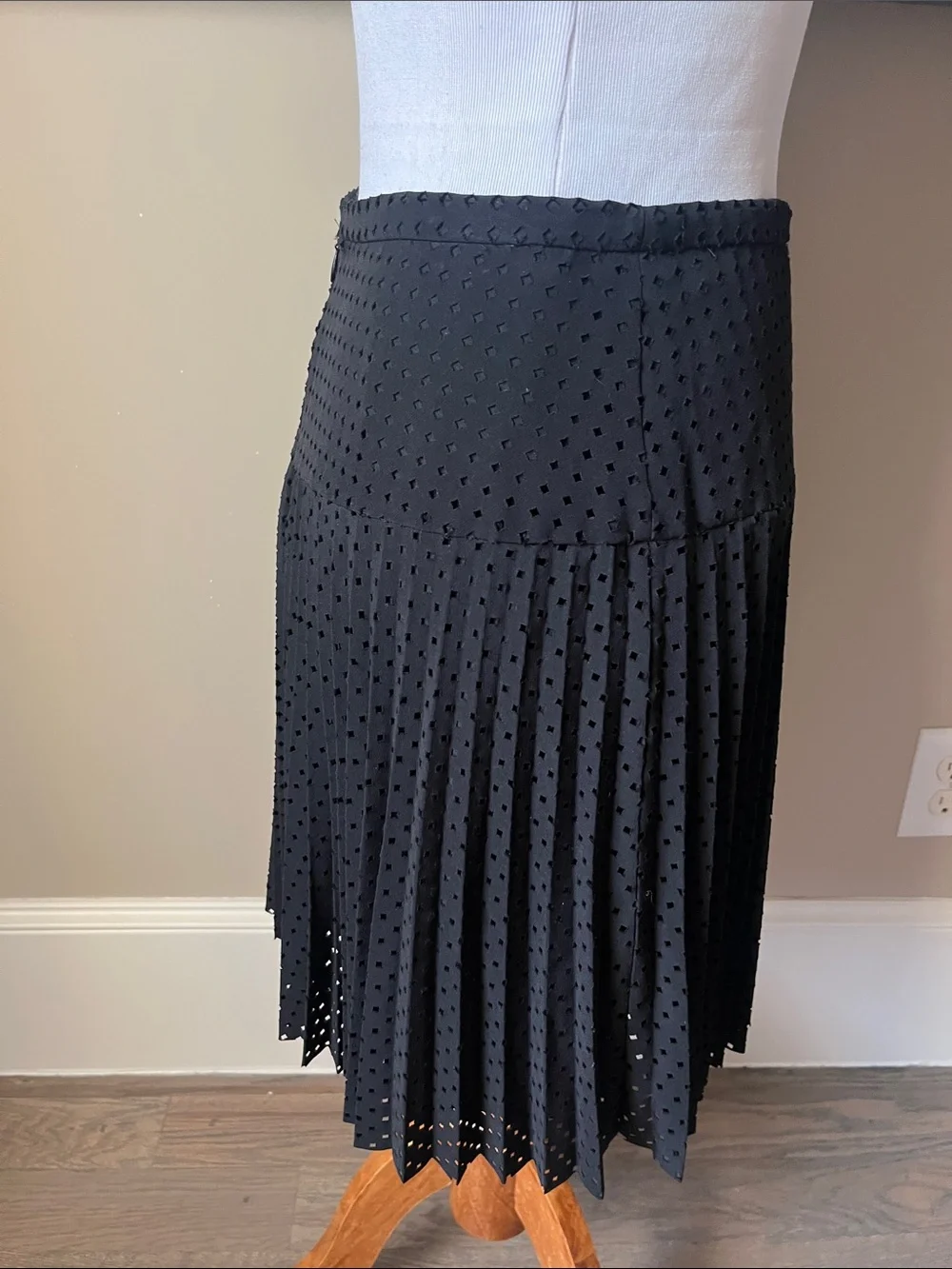 J. Crew black laser cut pleated A-line skirt.